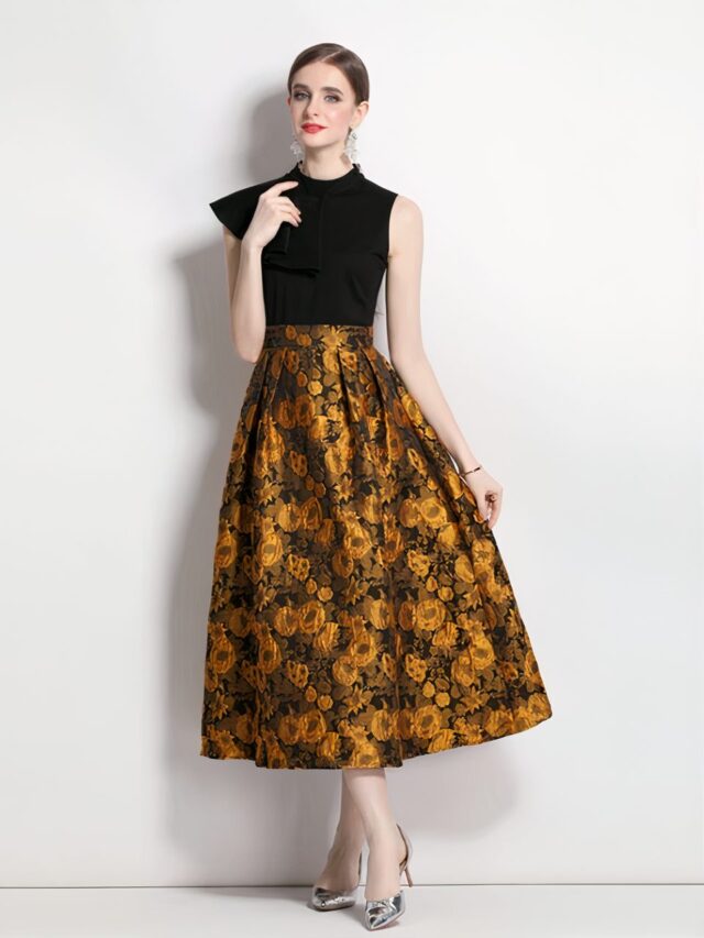 Photo d'une robe vintage jaune et noire portée par une jeune femme châtain sur un fond gris clair