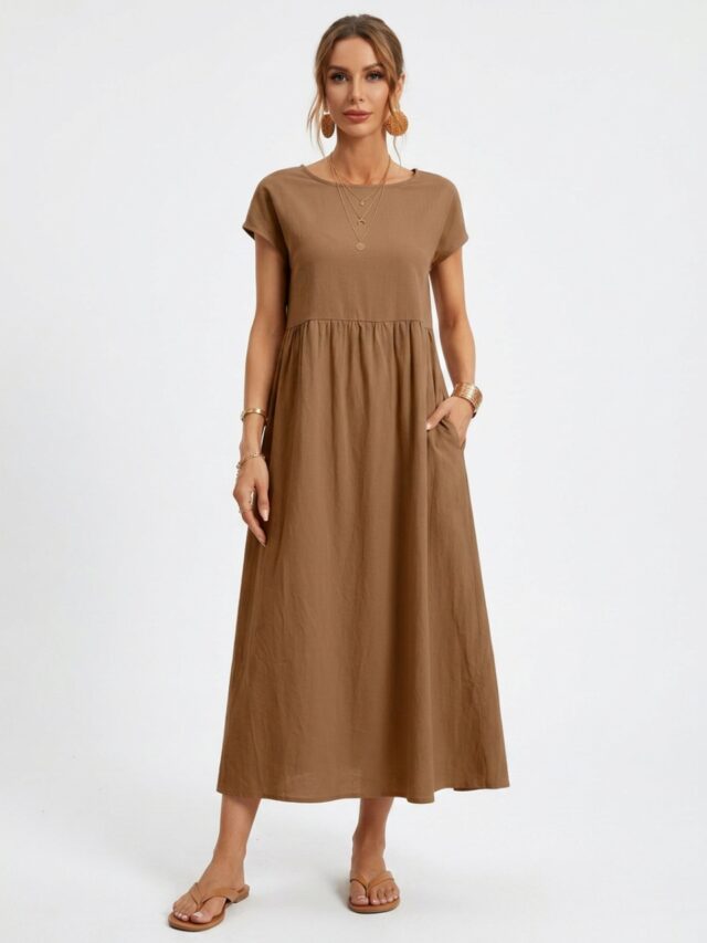 Photo studio d'une femme portant une robe en popeline marron camel